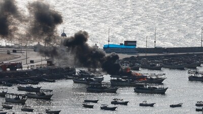 Israel-Palestine Conflict: Smoke billows from a boat following Israeli strikes, at Port of Gaza. (Reuters)