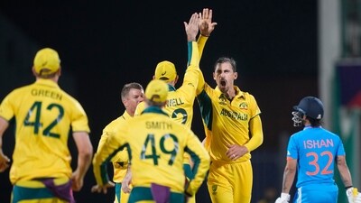 Australia's Mitchell Starc celebrates the wicket of India's Ishan Kishan (AP) Australia's Mitchell Starc celebrates the wicket of India's Ishan Kishan (AP)