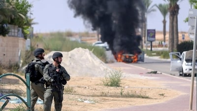 Israel-Palestine Conflict: Israeli soldiers take position at the southern Israeli town of Ofakim. (AP) Israel-Palestine Conflict: Israeli soldiers take position at the southern Israeli town of Ofakim. (AP)