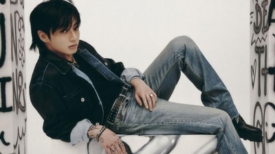 Jungkook served a sultry moment in this picture with his intense gaze and a stylish fit featuring a denim jacket, black tee and acid-washed straight-fit denim jeans. He styled it with statement rings, a chunky silver neck chain, a chain-link bracelet, a lip ring, a messy hairdo, and chunky Chelsea boots. (Instagram) Jungkook served a sultry moment in this picture with his intense gaze and a stylish fit featuring a denim jacket, black tee and acid-washed straight-fit denim jeans. He styled it with statement rings, a chunky silver neck chain, a chain-link bracelet, a lip ring, a messy hairdo, and chunky Chelsea boots. (Instagram)
