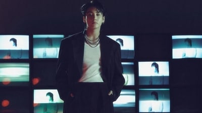 Meanwhile, JK chose stylish fits for the Golden concept photoshoot. In this click, the Golden Maknae looks stunning in a white tank top styled with a black notch-lapel blazer and high-waisted flared pants. He accessorised the dapper look with layered silver chains, hoop earrings, and a lip ring. A side-parted messy hairdo gave the finishing touch. (Instagram) Meanwhile, JK chose stylish fits for the Golden concept photoshoot. In this click, the Golden Maknae looks stunning in a white tank top styled with a black notch-lapel blazer and high-waisted flared pants. He accessorised the dapper look with layered silver chains, hoop earrings, and a lip ring. A side-parted messy hairdo gave the finishing touch. (Instagram)