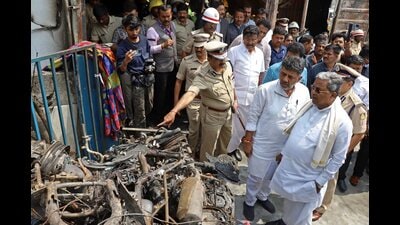 Karnataka chief minister Siddaramaiah with deputy chief minister DK Shivakumar at the site where a firecracker shop-cum-godown caught fire on Saturday, at Attibele in Bengaluru district, on Sunday. (PTI) Karnataka chief minister Siddaramaiah with deputy chief minister DK Shivakumar at the site where a firecracker shop-cum-godown caught fire on Saturday, at Attibele in Bengaluru district, on Sunday. (PTI)