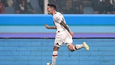AC Milan's Christian Pulisic celebrates scoring their first goal (REUTERS)
