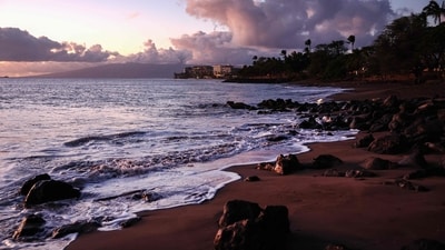 Waves roll in with resort properties in the distance nearly two months after a devastating wildfire in Lahaina, Hawaii. A phased reopening of tourist resort areas in west Maui is set to begin October 8th on the two-month anniversary of the deadliest wildfire in modern US history. (Photo by MARIO TAMA / Getty Images via AFP) Waves roll in with resort properties in the distance nearly two months after a devastating wildfire in Lahaina, Hawaii. A phased reopening of tourist resort areas in west Maui is set to begin October 8th on the two-month anniversary of the deadliest wildfire in modern US history. (Photo by MARIO TAMA / Getty Images via AFP)
