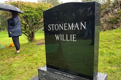 The gravestone of James Murphy, a man who was accidentally mummified and known publicly by the name "Stoneman Willie". (Reuters)