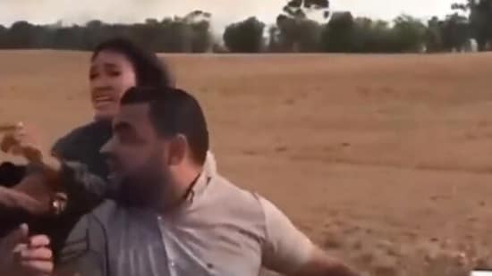 Noa Argamani being taken as hostage by the Hamas militants. (X/HenMazzig)