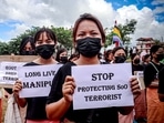 Khurai Pana Naha Sing (Youth of Khurai Pana) holding placards take part in a silent protest rally in Manipur.
