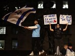 People take part in a 'Vigil for Israel' opposite the entrance to Downing Street, the official residence of Britain's Prime Minister, in London on October 9