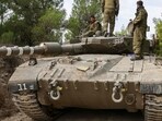 Israel-Palestine War: Israeli soldiers ride on a Merkava tank as it drives to an undisclosed location in northern Israel. Israel-Palestine War: Israeli soldiers ride on a Merkava tank as it drives to an undisclosed location in northern Israel.