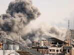 Israel-Palestine Latest: A plume of smoke billows behind highrise buildings in the sky during an Israeli airstrike on Gaza City. Israel-Palestine Latest: A plume of smoke billows behind highrise buildings in the sky during an Israeli airstrike on Gaza City.