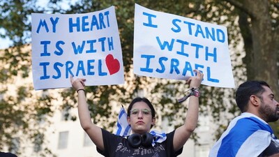 People attending a vigil outside Downing Street for victims and hostages of Hamas attacks, organised by The Board of Deputies of British Jews, in London, Monday, Oct. 9, 2023, as the death toll rises amid ongoing violence in Israel and Gaza following the attack by Hamas. (AP) People attending a vigil outside Downing Street for victims and hostages of Hamas attacks, organised by The Board of Deputies of British Jews, in London, Monday, Oct. 9, 2023, as the death toll rises amid ongoing violence in Israel and Gaza following the attack by Hamas. (AP)