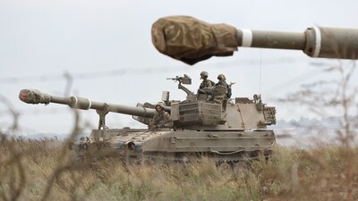 Israeli army soldiers are positioned with their armoured vehicles near the border with the Gaza Strip in southern Israel on October 9, 2023. (AFP) Israeli army soldiers are positioned with their armoured vehicles near the border with the Gaza Strip in southern Israel on October 9, 2023. (AFP)