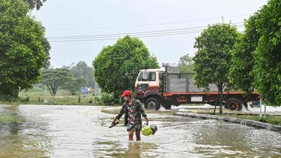 Myanmar Floods: A woman wades through a flooded street in Hpa Yar Gyi township in Myanmar's Bago region. (AFP) Myanmar Floods: A woman wades through a flooded street in Hpa Yar Gyi township in Myanmar's Bago region. (AFP)