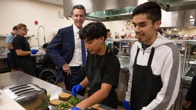 California Gov. Gavin Newsom talks with students in the Career Technical Education Pathways program at River City High School in West Sacramento, Calif., on Thursday, Aug. 31, 2023. (Paul Kitagaki Jr./The Sacramento Bee via AP, Pool) (AP) California Gov. Gavin Newsom talks with students in the Career Technical Education Pathways program at River City High School in West Sacramento, Calif., on Thursday, Aug. 31, 2023. (Paul Kitagaki Jr./The Sacramento Bee via AP, Pool) (AP)