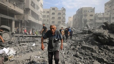 Israel-Palestine War: Palestinians evacuate the area following an Israeli airstrike in Gaza City. (AFP) Israel-Palestine War: Palestinians evacuate the area following an Israeli airstrike in Gaza City. (AFP)