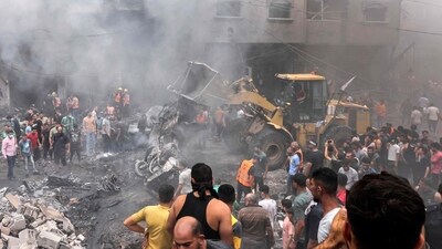 Palestinian search for survivors after an Israeli airstrike on buildings in the refugee camp of Jabalia in the Gaza Strip on October 9. Israel relentlessly pounded the Gaza Strip early on Monday as fighting raged with Hamas around the Gaza Strip. (AFP)
