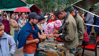 Troops of TriShakti Corps provides assistance to tourists stranded in areas of Lachen, Lachung, Thangu and Chungthang following flash floods in North Sikkim. (PTI) Troops of TriShakti Corps provides assistance to tourists stranded in areas of Lachen, Lachung, Thangu and Chungthang following flash floods in North Sikkim. (PTI)