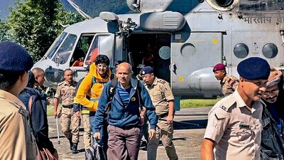 Tourists evacuated from flood-affected Lachen by helicopter arrive at Ringhim Helipad, Mangan in North Sikkim. (PTI) Tourists evacuated from flood-affected Lachen by helicopter arrive at Ringhim Helipad, Mangan in North Sikkim. (PTI)