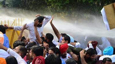Police used a water cannon to prevent protesting Congress workers from marching to Raj Bhavan in Chandigarh on Monday. (Ravi Kumar/HT) Police used a water cannon to prevent protesting Congress workers from marching to Raj Bhavan in Chandigarh on Monday. (Ravi Kumar/HT)