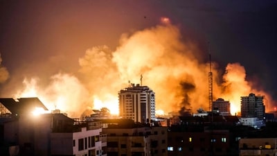 A fireball erupts during Israeli bombardment of Gaza City on October 9 (AFP) A fireball erupts during Israeli bombardment of Gaza City on October 9 (AFP)