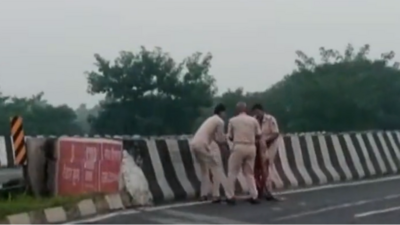 Screengrab of the incident shows three cops throwing the remains of the victim into a canal in Bihar. Screengrab of the incident shows three cops throwing the remains of the victim into a canal in Bihar.
