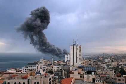 Smoke rise above buildings during an Israeli air strike in Gaza City on October 9. (AFP) Smoke rise above buildings during an Israeli air strike in Gaza City on October 9. (AFP)