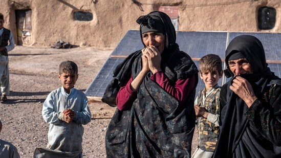 Afghanistan Earthquake: Afghan women mourn for relatives killed in an earthquake to a burial site after an earthquake in Zenda Jan district in Herat province. (AP)