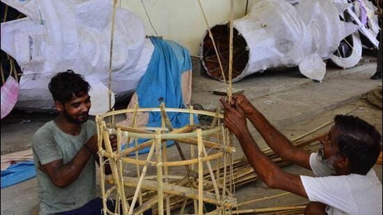 The artisans have replaced the mix of paper and polythene used to make the effigies with imported paper from the US to lower toxic emissions and reduce plastic waste. (Manish/HT)