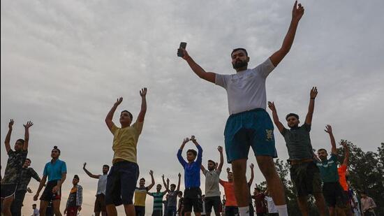 Youngsters do physical exercises for upcoming 'Agniveer' recruitment rally near the International Border in Ranbir Singh Pura (PTI File Photo)