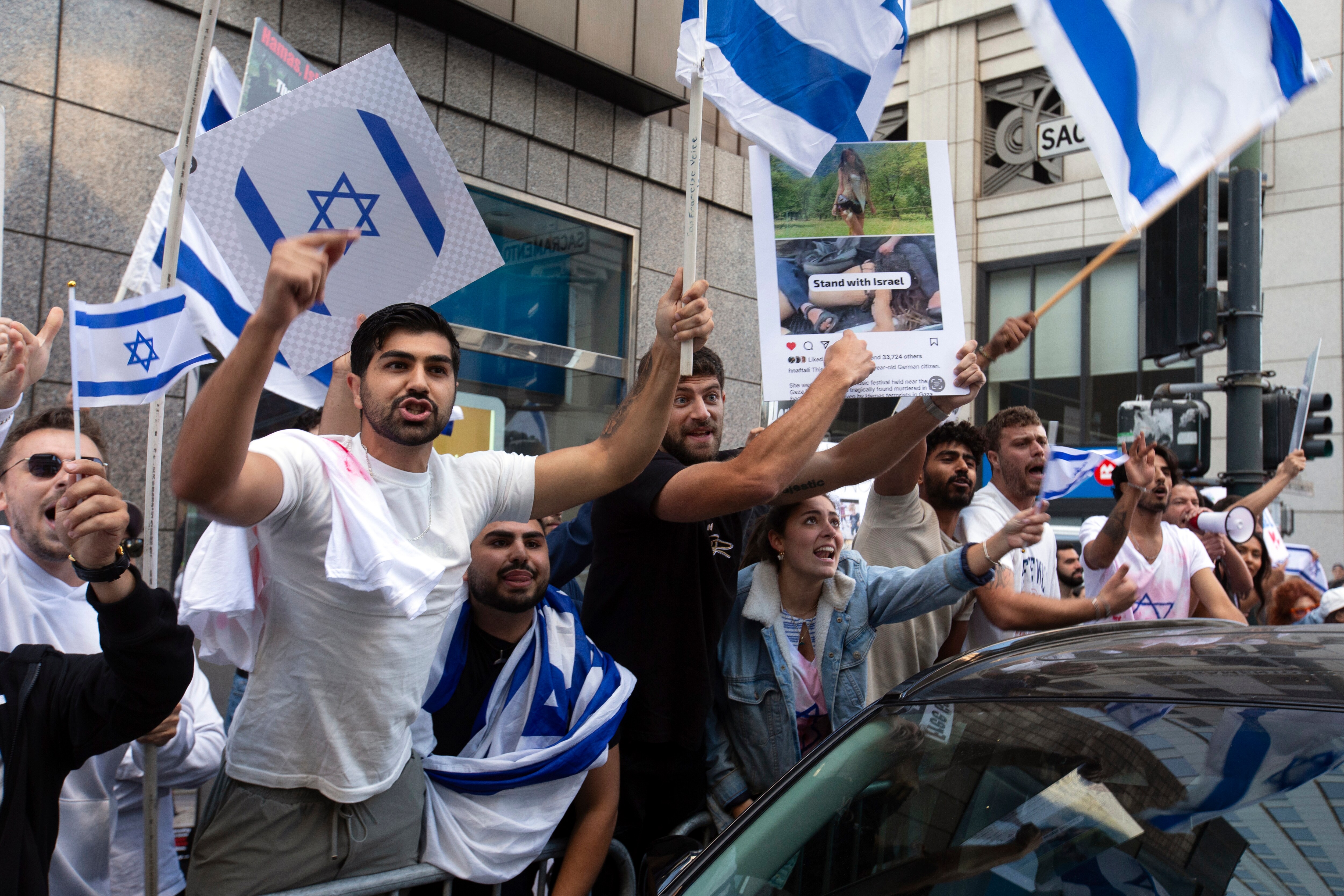 Pro-Israel counter-protesters wave signs during a pro-Palestinian demonstration outside the Israeli embassy, Sunday, Oct. 8, 2023, in San Francisco. (AP Photo/D. Ross Cameron) (AP) Pro-Israel counter-protesters wave signs during a pro-Palestinian demonstration outside the Israeli embassy, Sunday, Oct. 8, 2023, in San Francisco. (AP Photo/D. Ross Cameron) (AP)