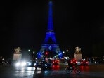 This photograph taken on October 9, 2023 shows the Eiffel Tower illuminated with the Star of David and the colours of national flag of Israel.