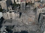 Israel-Palestine War: Destroyed buildings and residential towers following an Israeli missile attack in the Rimal district of Gaza City, Gaza. Israel-Palestine War: Destroyed buildings and residential towers following an Israeli missile attack in the Rimal district of Gaza City, Gaza.