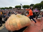 A pumpkin called "Michael Jordan," grown by Travis Gienger of Anoka, Minn., is displayed before being weighed at the Safeway 50th annual World Championship Pumpkin Weigh-Off in Half Moon Bay, Calif., Monday, Oct. 9, 2023.(AP Photo/Eric Risberg)