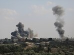Smoke rises from an explosion caused by Israeli airstrikes on the border between Egypt and Rafah, Gaza Strip, Tuesday, Oct. 10, 2023. (AP Photo/Hatem Ali)