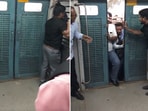 The image shows the commuters trying to board a local train.  