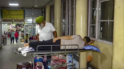 A patient takes rest outside the emergency hall after a fire break out in the computer room of the PGI's Nehru Hospital, in Chandigarh on Tuesday early morning. (ANI) A patient takes rest outside the emergency hall after a fire break out in the computer room of the PGI's Nehru Hospital, in Chandigarh on Tuesday early morning. (ANI)