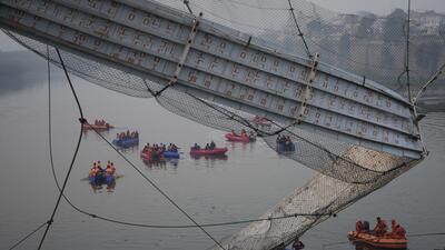 At least 135 people were killed and 56 others injured after a bridge collapse in Gujarat (AP) At least 135 people were killed and 56 others injured after a bridge collapse in Gujarat (AP)