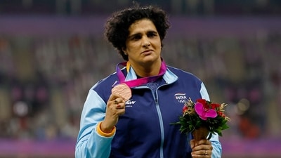 India's Seema Punia celebrates on the podium during the women's discus throw medal ceremony (REUTERS)