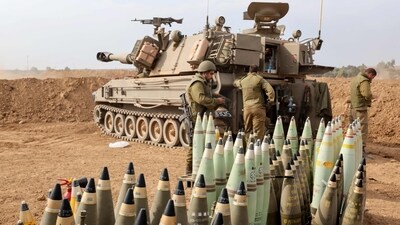 Artillery shells are lined up next to an armoured vehicle as Israeli soldiers take positions near the border with Gaza in southern Israel on October 9. (AFP) Artillery shells are lined up next to an armoured vehicle as Israeli soldiers take positions near the border with Gaza in southern Israel on October 9. (AFP)