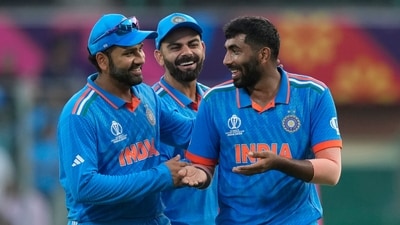 India's India's Jasprit Bumrah , Virat Kohli and captain Rohit Sharma celebrates the wicket of Australia's captain Pat Cummins (AP) India's India's Jasprit Bumrah , Virat Kohli and captain Rohit Sharma celebrates the wicket of Australia's captain Pat Cummins (AP)