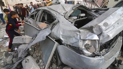 Israel-Palestine Conflict: Palestinians inspect the damage of destroyed building after Israeli airstrikes in Khan Younis, Gaza Strip. (AP)