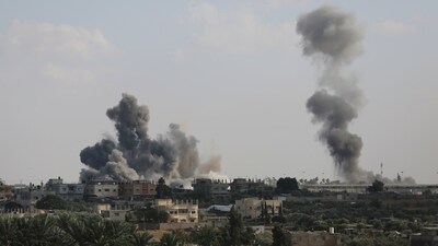 Smoke rises from an explosion caused by Israeli airstrikes on the border between Egypt and Rafah, Gaza Strip, Tuesday, Oct. 10, 2023. (AP Photo/Hatem Ali) (AP)