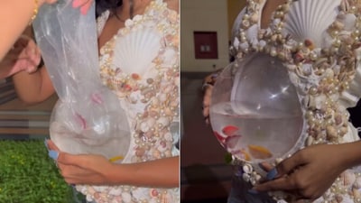Snapshot of the woman wearing live fish in a dress. (Instagram/@ohsopretty_makeover.) Snapshot of the woman wearing live fish in a dress. (Instagram/@ohsopretty_makeover.)