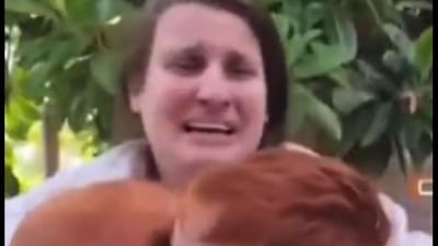 Shiri Silberman-Bibas appears visibly distressed and frightened in the video as she clutches her children, three years old and nine months old (@IldemocracyHQ screenshot/X) Shiri Silberman-Bibas appears visibly distressed and frightened in the video as she clutches her children, three years old and nine months old (@IldemocracyHQ screenshot/X)