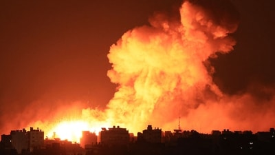 Explosions illuminate the sky during Israeli strikes on Gaza City on October 10, 2023 (AFP) Explosions illuminate the sky during Israeli strikes on Gaza City on October 10, 2023 (AFP)
