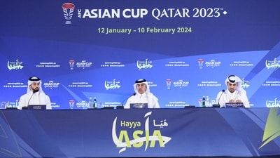 Hassan Rabea Al Kuwari, Executive Director of Marketing and Communications at the Local Organising Committee for the AFC Asian Cup Qatar 2023, and Abdulaziz Al-Mawlawi, Qatar Tourism Chief Marketing Officer, sit alongside the moderator at a press conference (REUTERS)