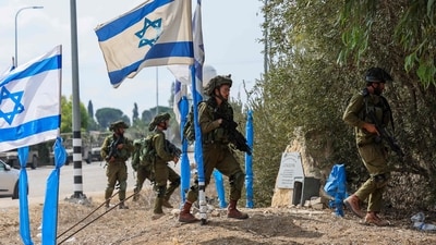Israeli soldiers patrol an area in Kfar Aza, south of Israel bordering Gaza Strip (AFP) Israeli soldiers patrol an area in Kfar Aza, south of Israel bordering Gaza Strip (AFP)