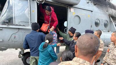 Tourists being evacuated by the Indian Air Force (IAF) from the flood-affected areas of Lachan, in Mangan district (PTI) Tourists being evacuated by the Indian Air Force (IAF) from the flood-affected areas of Lachan, in Mangan district (PTI)