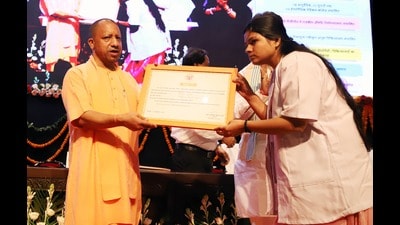 U.P. chief minister Yogi Adityanath giving appointment letter to a newly selected homeopathic pharmacist. (HT photo) U.P. chief minister Yogi Adityanath giving appointment letter to a newly selected homeopathic pharmacist. (HT photo)