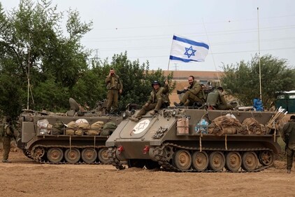 Israeli soldiers take positions in their armoured vehicles near the border with Gaza in southern Israel on October 9, 2023. (AFP) Israeli soldiers take positions in their armoured vehicles near the border with Gaza in southern Israel on October 9, 2023. (AFP)